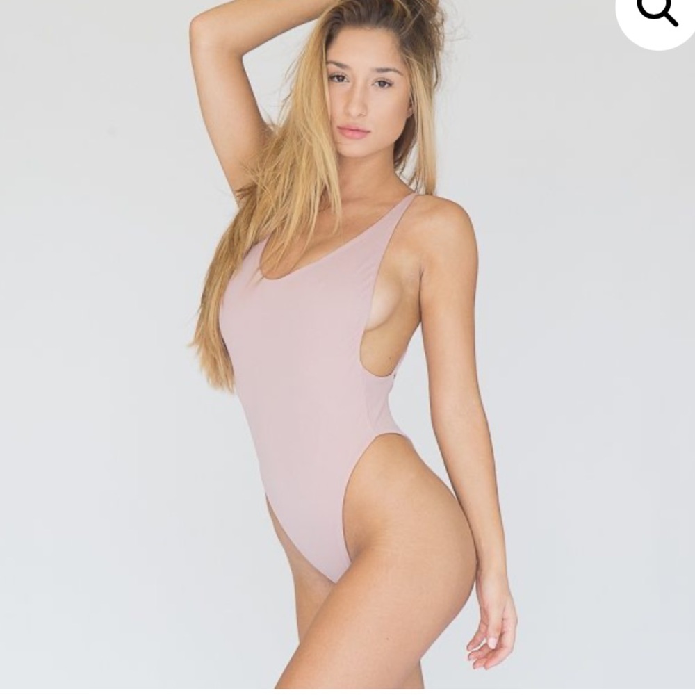 Disruptive youth woman’s dirty pink bathing suit one piece